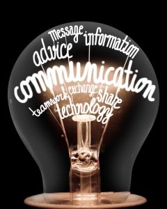 Photo of light bulb highlighting "Communication"